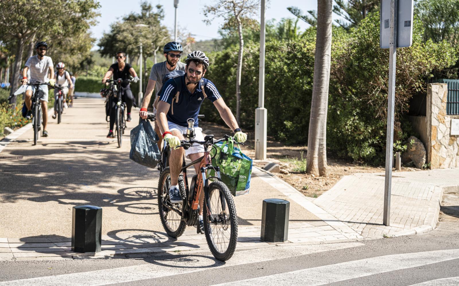 Biking and collecting trash Mallorca